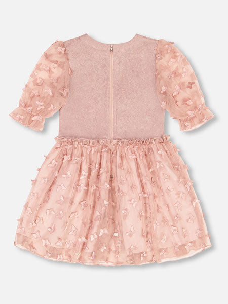 Back view of rose pink girls party dress by Deux Par Deux. Short sleeve velvet bodice with sheer puffed sleeves, a round neckline, and an elastic waist flared A-line skirt covered in butterfly appliques.