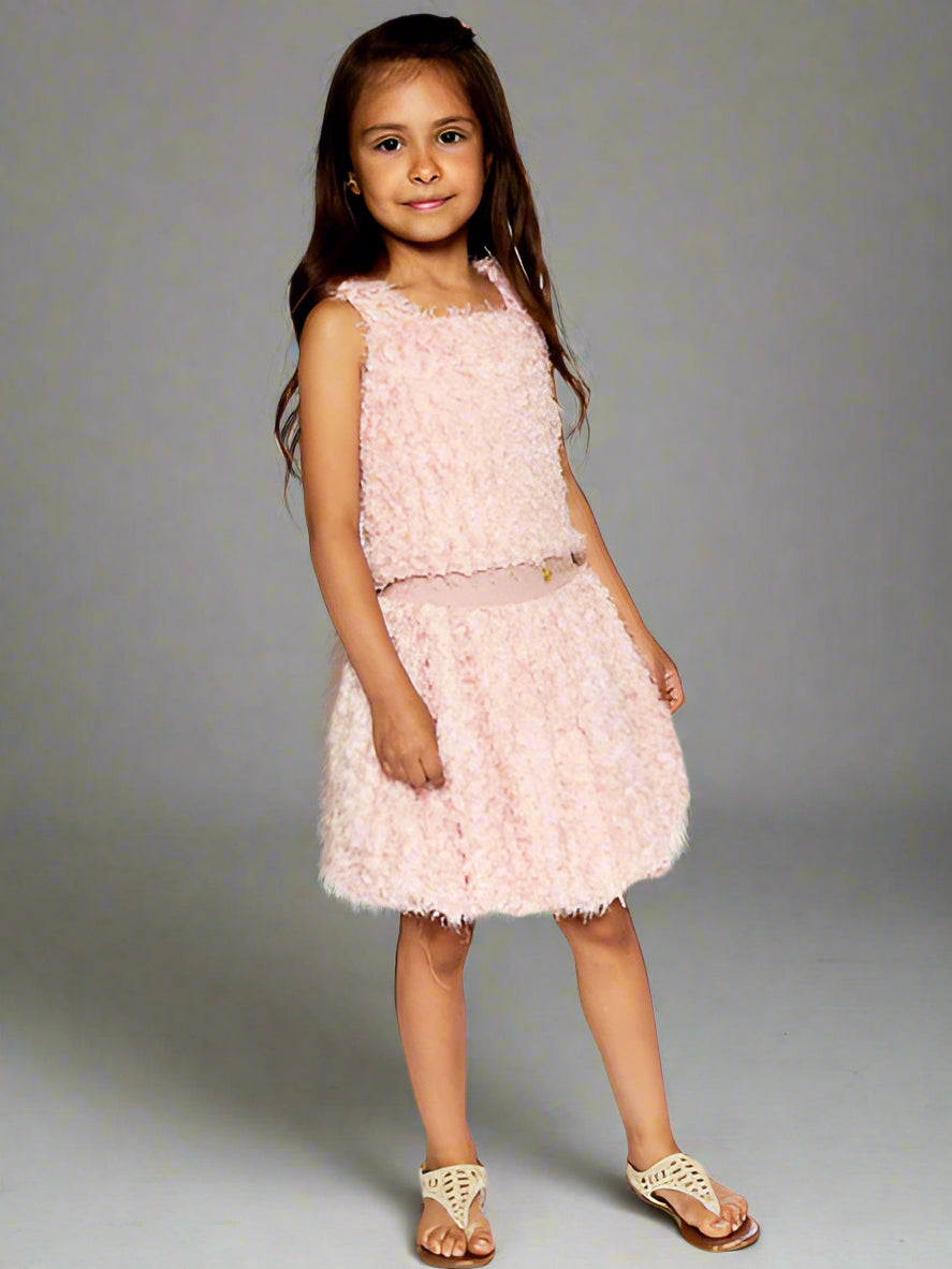 Girl modeling a pretty pink two piece set features a sleeveless top with wide straps, a square neckline, and a matching bubble skirt with a stretch elastic waistband. By Deux Par Deux.