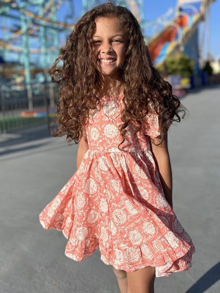 Ruffled trim sleeveless summer dress. Ivory and rose floral print. for toddler and little girls.