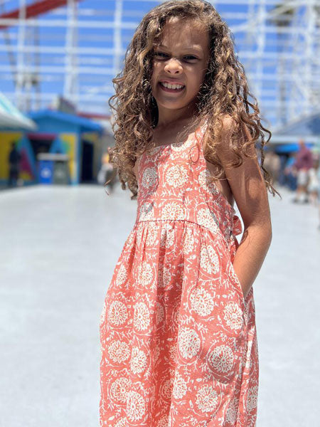 Girls classic sundress in an ivory and rose print.