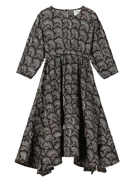 Girls handkerchief hem dress featuring a stunning floral block print fabric. Tiered frills on the skirt and a side tie at the waist.