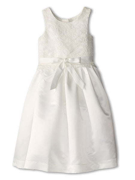 A white satin flower girl dress with white lace details, round pearlized back buttons, and a tulle-trimmed underskirt.