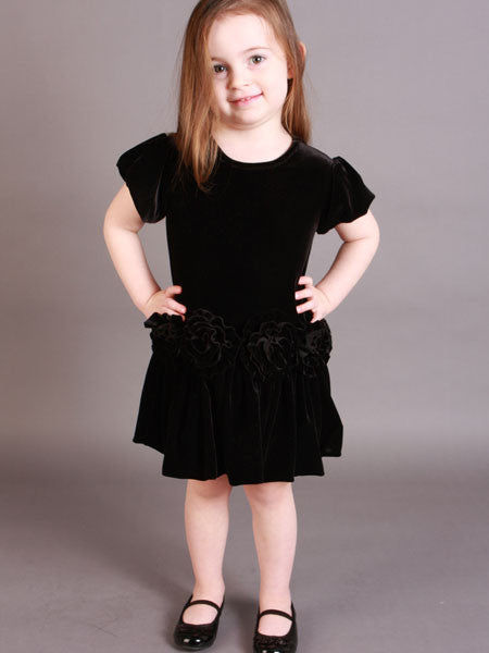 Black velvet velour girls party dress by Mulberribush. Short sleeves. Drop waist with rosette trim, gathered skirt.