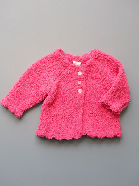 Soft chenille baby girls cardigan sweater in pink. Scalloped edges, three white  button closure in front.