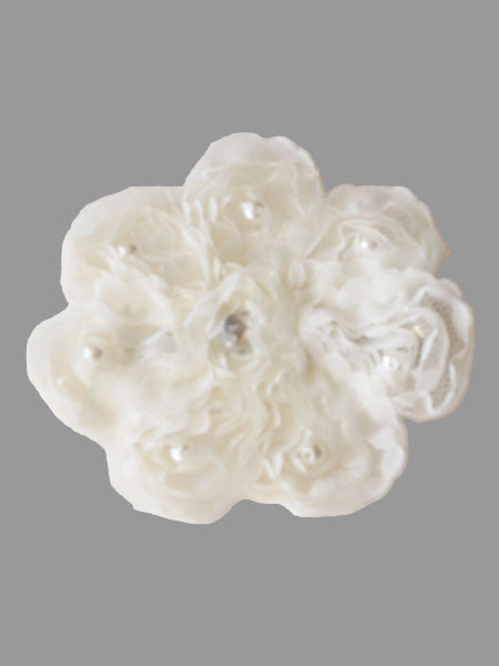 An ivory chiffon hair clippie adorned with crystal beads, designed as a flower with multiple layers.