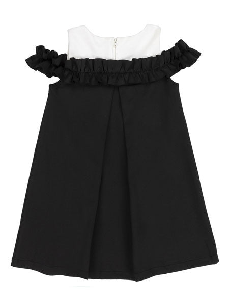 Back view of Deux Par Deux girls black party dress, cold shoulder style. White accent fabric at neckline.