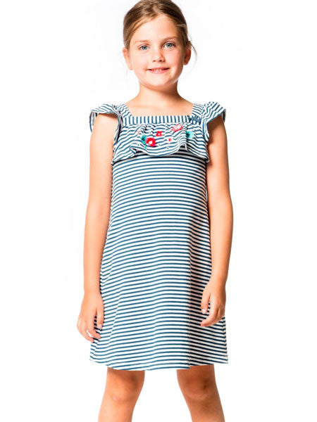 Girl wearing navy and white stripe sundress by Deux par Deux. Ruffle accents on sleeveless straps and  high waist edge.