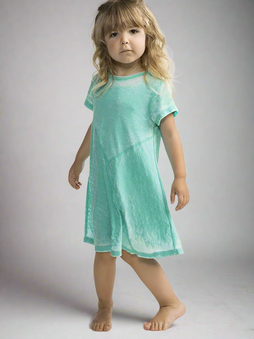 Young girl wearing a teal  short sleeve dress.