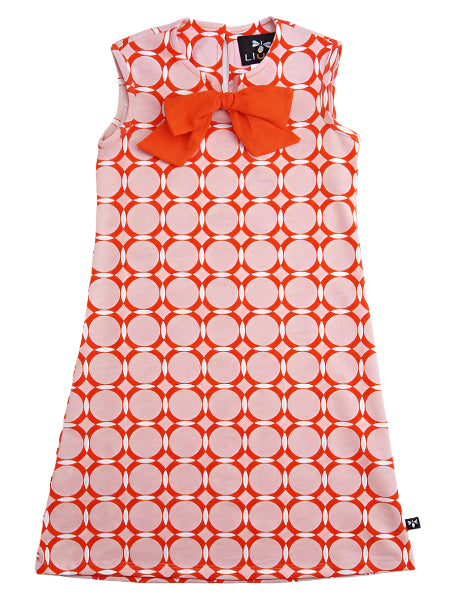 Shift style baby and toddler girls knit dress. Pink and orange geometric print. Orange bow at front center neckline.
