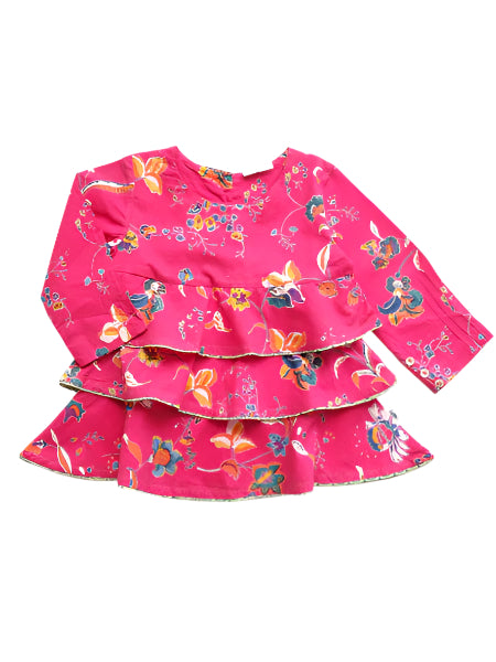 A long sleeve light weight tiered cotton top in Dorset pink with a floral pattern, featuring three button closure in the back.
