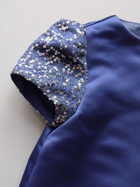 Detail of blue sequined sleeve.
