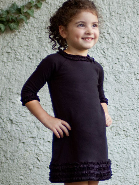 Black medium weight jersey knit dress, long sleeves. Ruffle trim on collar, sleeves, and hem line.