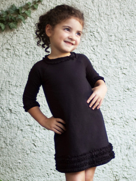Black medium weight jersey knit dress, long sleeves. Ruffle trim on collar, sleeves, and hem line.