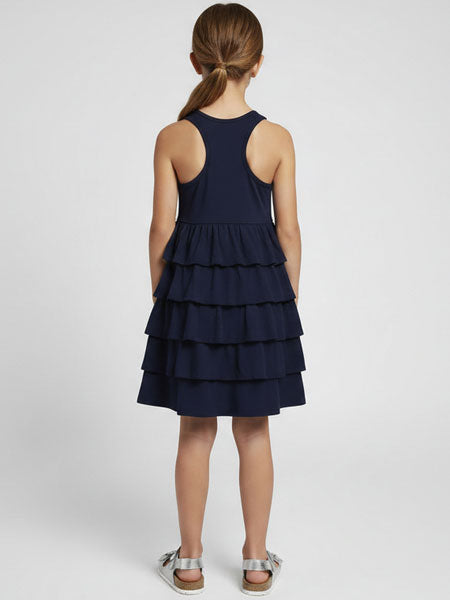 Navy blue tiered dress worn by a person on a white background