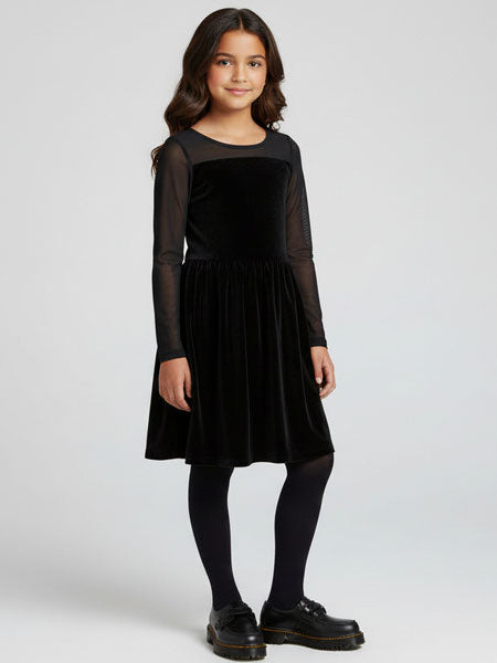 Young girl wearing a black dress on a white background