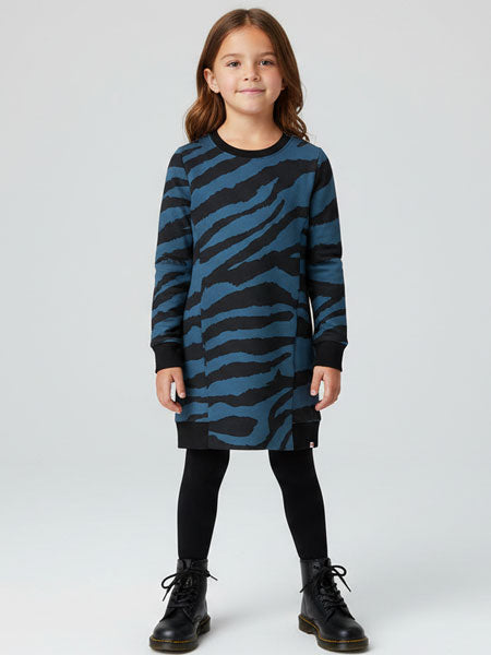 Child wearing a blue and black zebra pattern dress on a white background
