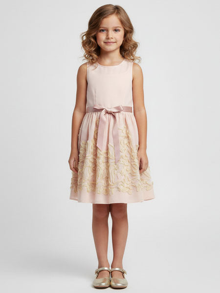 Young girl wearing a pink dress with a bow on a white background