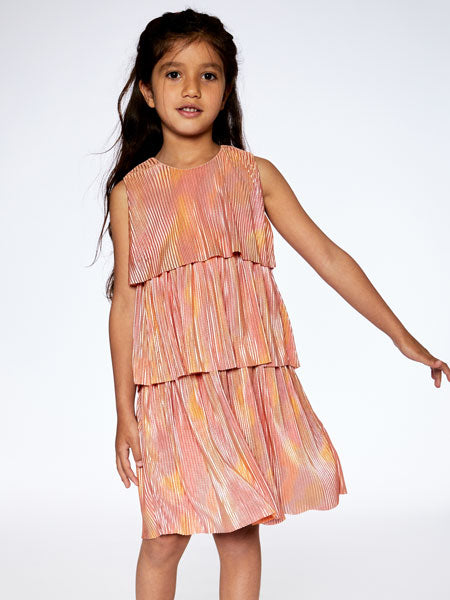 Girl modeling metallic rainbow print, this pleated party dress features a sleeveless bodice with wide straps, a round neckline, and three separate tiers. By Deux Par Deux.