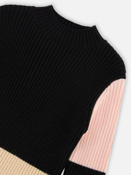 Detail of color block knitted girls sweater dress in pink, beige and black. Contemporary style by Deux Par Deux.