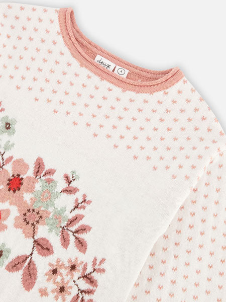 Detail of off white, long sleeve girls sweater dress with pastel hues with bold flowers for fall and winter. The brand is Deux Par Deux.