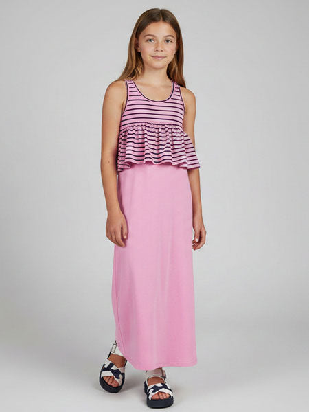 Young girl wearing a striped top and pink skirt dress on a white background
