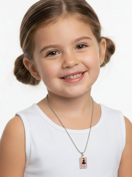 Young girl wearing a necklace with a pendant on a white background