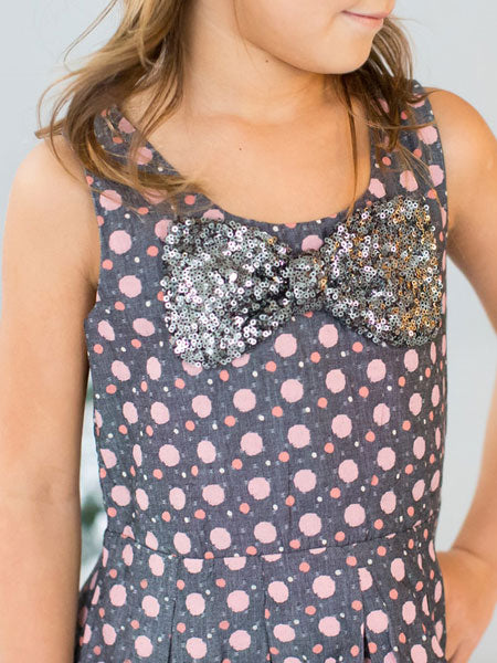 Sleeveless gray cotton chambray party dress with pink dots and silver sequin bow.