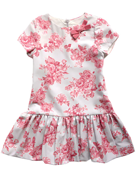 Girls floral dress with pink flowers on a white background