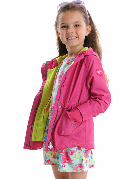 Girl modeling the pink windbreaker by Appaman. Hip-length. Elastic cinched waist. Ribbed wrists with thumbholes.