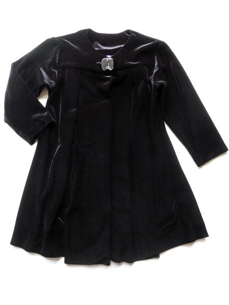 Black velvet topper coat. One square button closure at center.