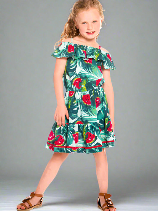 Girl wearing  the watermelon print girls sundress by Deux par Deux. Cold shoulder ruffle neckline with thin straps. Gathered waist with full skirt.
