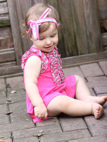 Baby girls one piece romper skort . Raspberry pink. Sleevless wiyh gray and pink striped ruffle trim on armholes and down the front to the waist