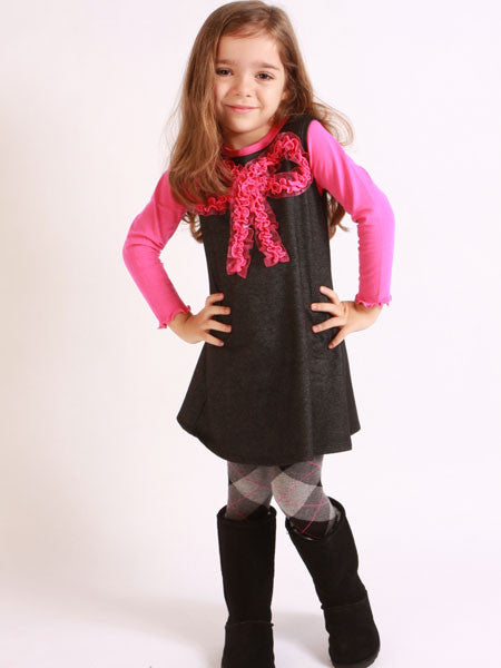 Black, denim look knit jumper dress. Pink tee shirt top, lettuce edge shirt and sleeve hems.