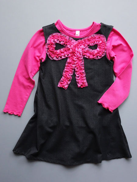 Black, denim look knit jumper dress. Pink tee shirt top, lettuce edge shirt and sleeve hems.