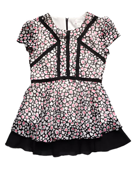 Heart print chiffon girls tunic dress. Pink and white hearts on sheer black fabric with white lining. Black accent fabric.