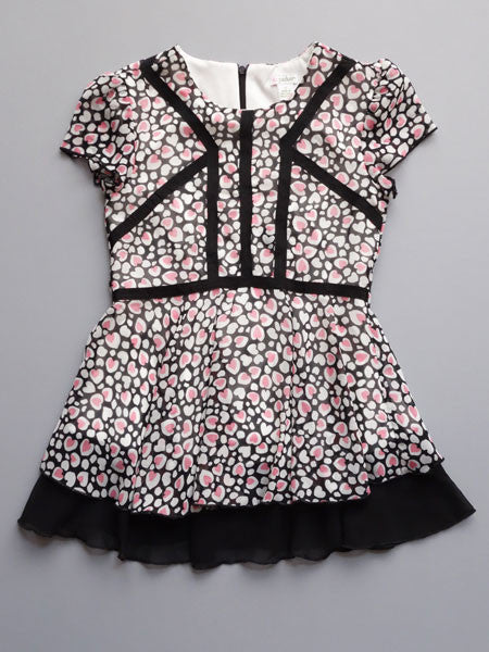 Heart print chiffon girls tunic dress. Pink and white hearts on sheer black fabric with white lining. Black accent fabric.