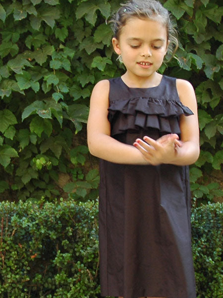 Silky black taffeta party dress for little girls. Sleeveless with a square neckline. 